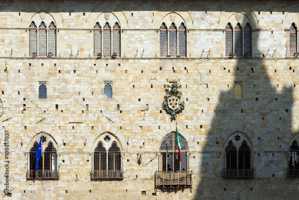 Facade of the palace of old people (Palazzo degli Anziani o di Giano) Town Hall of Pistoia Tuscany Italy - XIII - XIV century