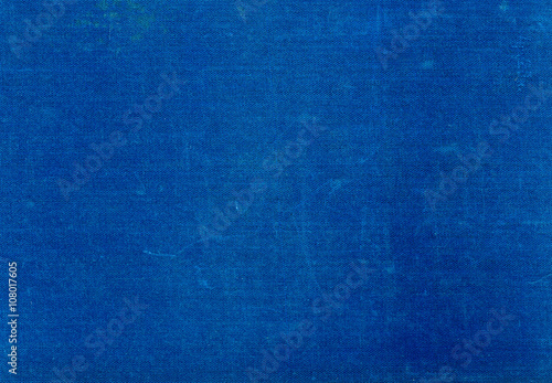 Grungy cyan blue textile surface with scratches.