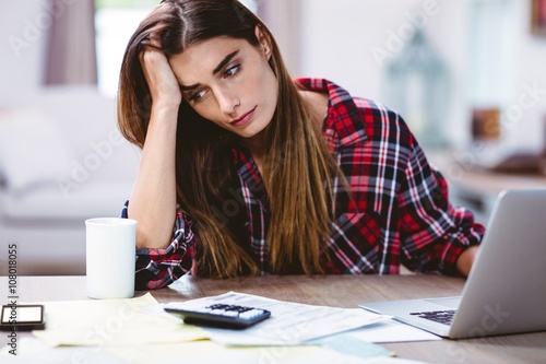 Frustrated young woman with laptop