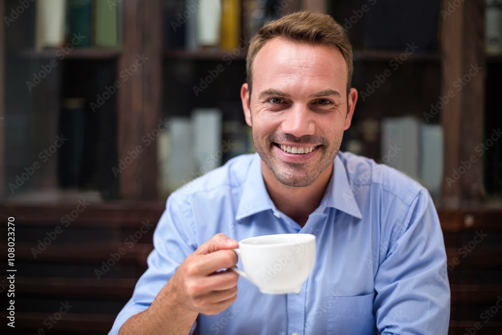 Portrait of happy man holding coffee cup Portrait of happy man holding coffee cup
