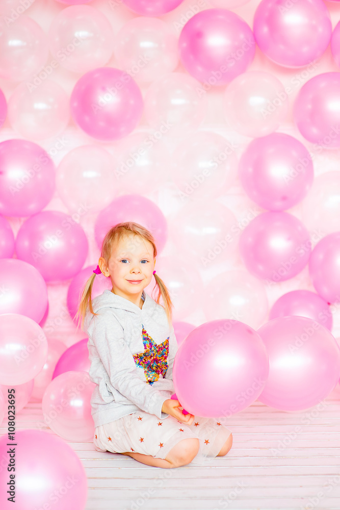 little girl playing with pink balloons little girl playing with pink balloons