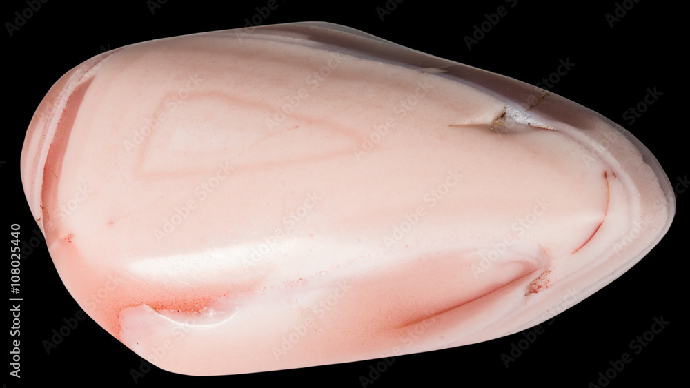 Chalcedony with stripes macro, isolated on black background Chalcedony with stripes macro, isolated on black background