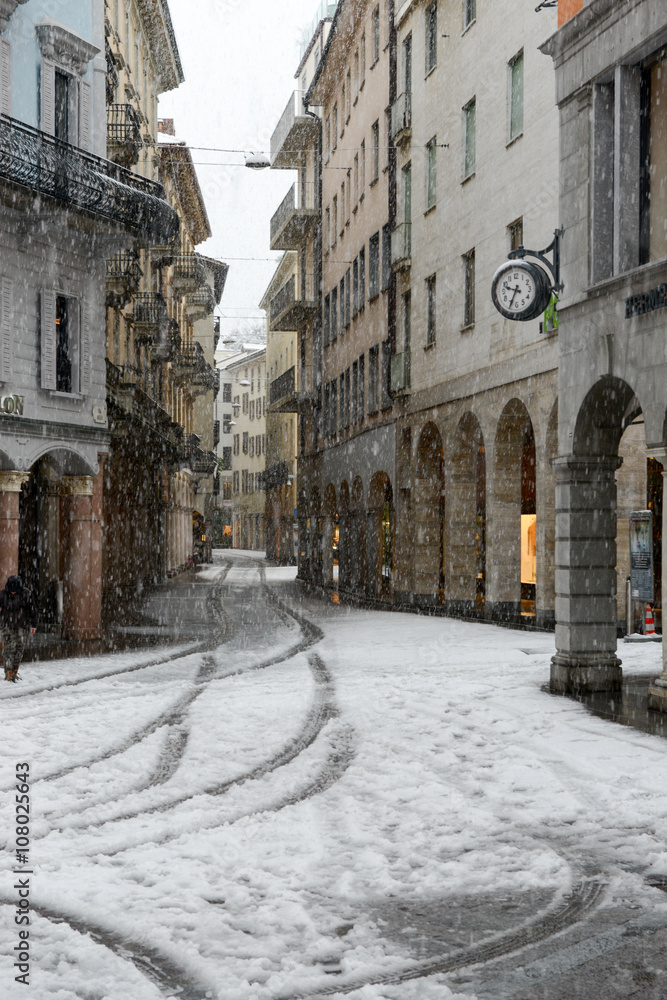 It's snowing on old part of Lugano on Switzerland.