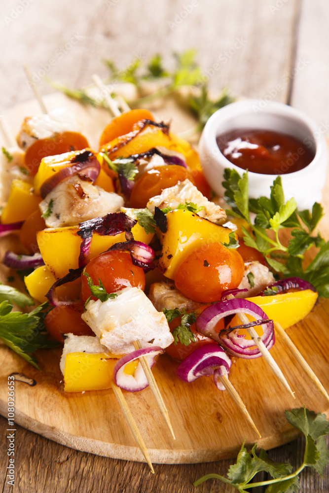 Fish skewers with vegetables and herbs