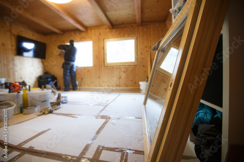 Obraz na płótnie Worker installing new wooden windows w salonie