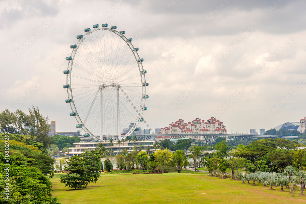 Ferris wheel and Singapore gardens at riverside Ferris wheel and Singapore gardens at riverside