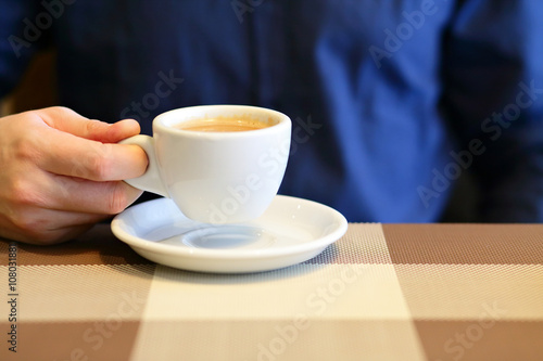 Cup of coffee in businessman hand  selective focus