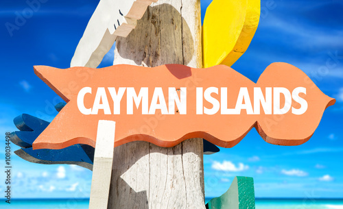 Cayman Islands signpost with beach background