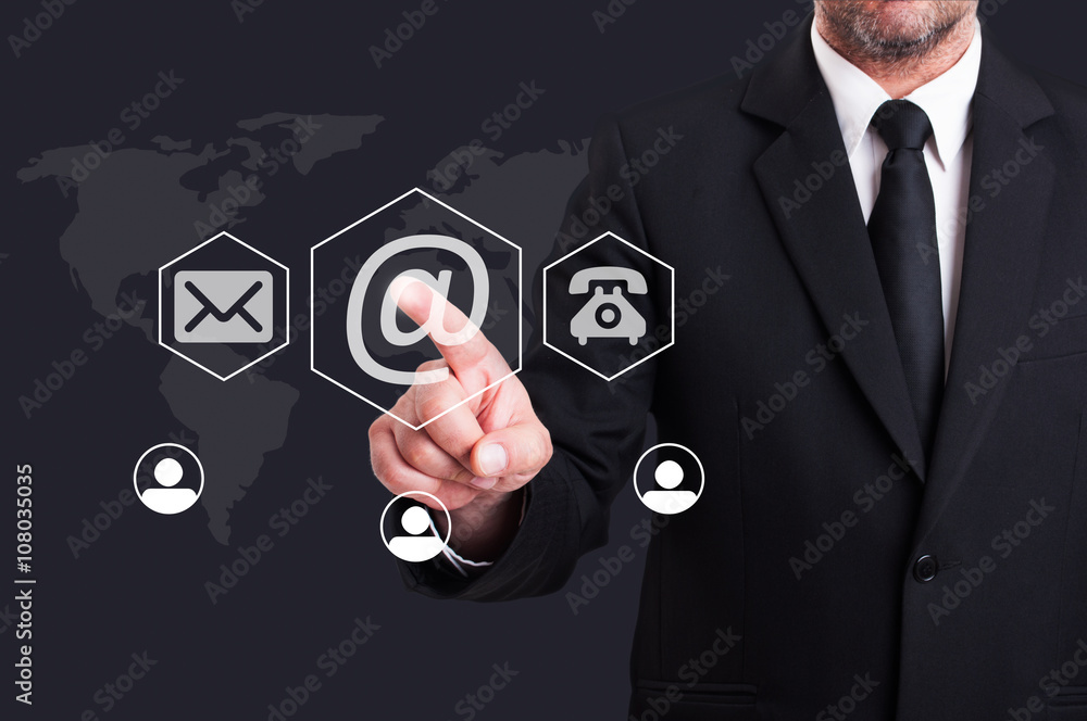Business man pressing contact us using email digital button Business man pressing contact us using email digital button