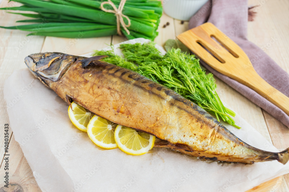 Baked sea fish ( mackerel) on wooden background. Baked sea fish ( mackerel) on wooden background.