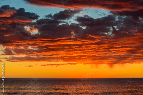 Fototapeta Naklejka Na Ścianę i Meble -  Dramatic sunset and storm clouds