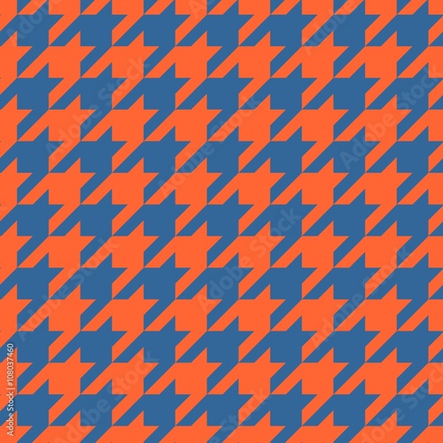 Houndstooth vector tile pattern. Traditional Scottish plaid fabric for colorful seamless website background or desktop wallpaper in red orange and navy blue color.
