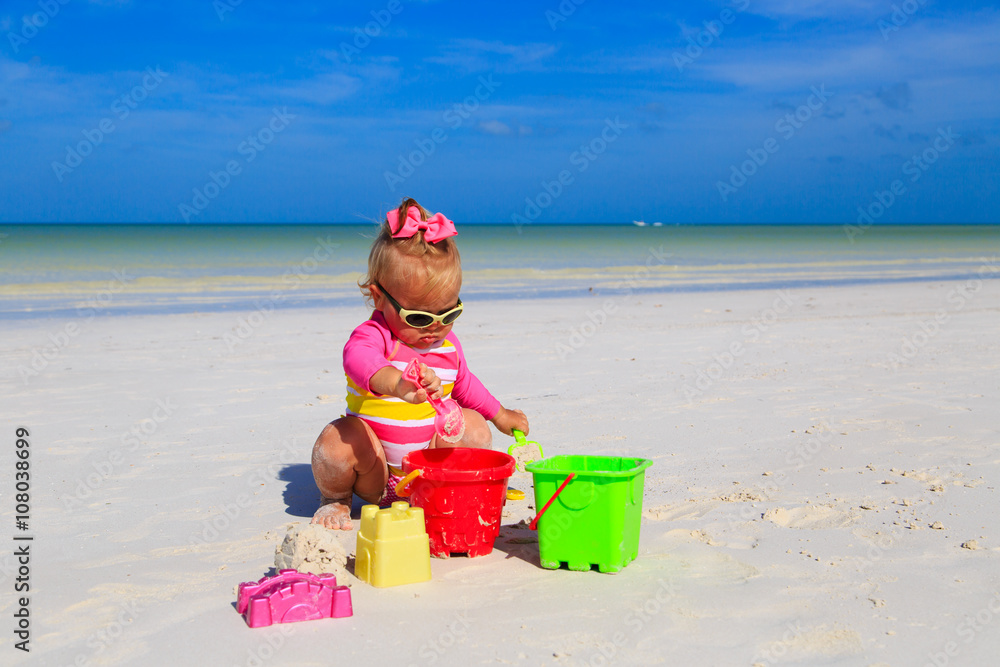 cute little girl playing on summer beach cute little girl playing on summer beach