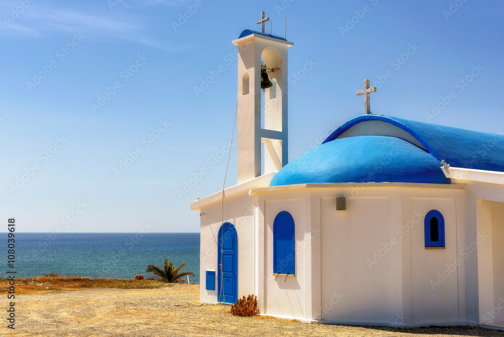 White and blue church on a shore in Aiya Napa, Cuprus