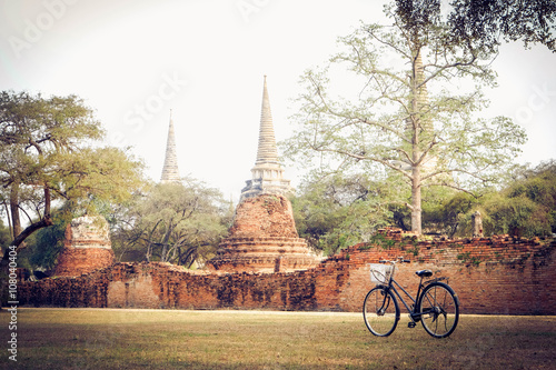 Classic and vintage bicycle with ancient temple background, Thai