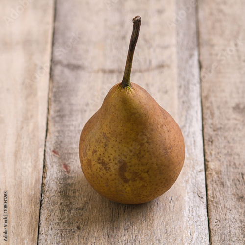 brown pear fruit close up shoot on wood