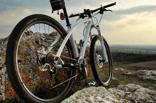 Fototapeta Naklejka Na Ścianę i Meble -  Bicycle stands on a rock