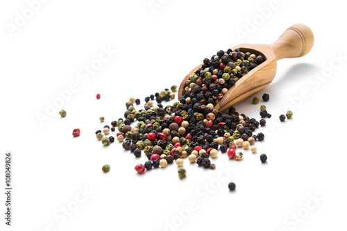 Coloured pepper in wooden spoon
