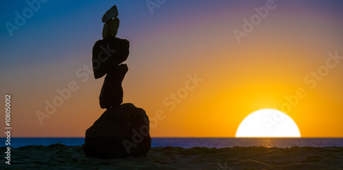 Photography Stone piramide. Sea sunset