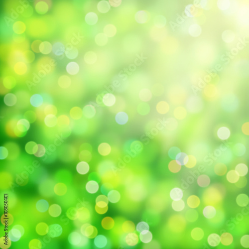 soft bokeh background in shades of green, white and yellow