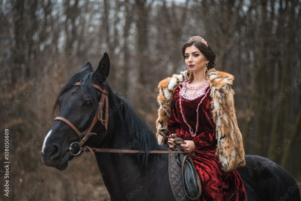 Obraz premium Princess with her horse in the woods