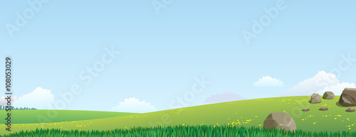 Panoramic views of the valley with green hills and stones on a sunny day