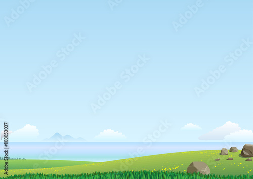 Landscape with green hills and the sea in the distance on a clear day