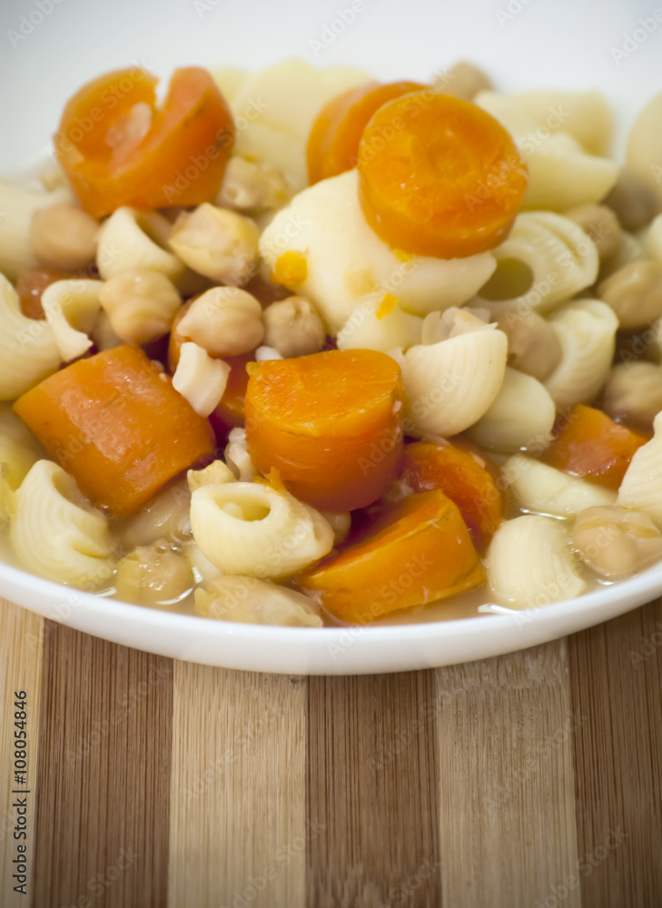 Vegetable soup with pasta, carrots and chickpeas