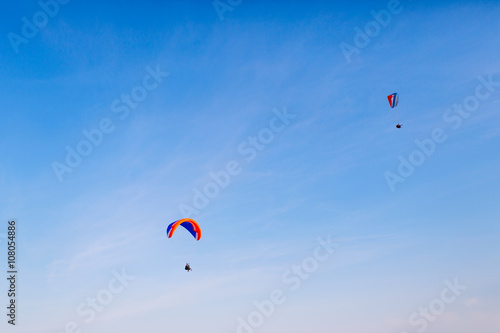 Two paraglider flying in the sky