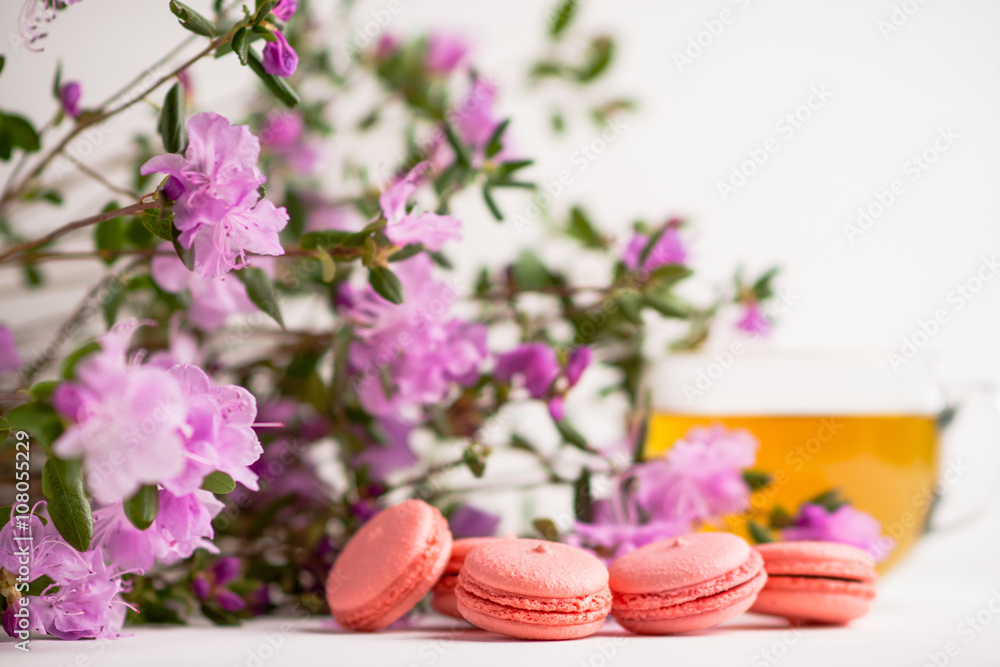 Pink macaroons on the white wooden background. Shallow depth of field.