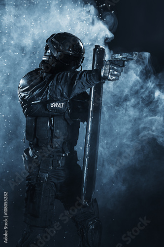 police officer with ballistic shield