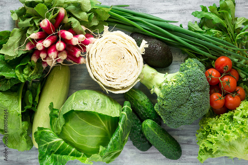 Fresh vegetables on grey wooden background photo