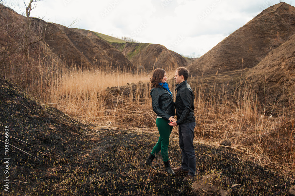 Fototapeta premium Happy couple smiling outdoors in the mountains