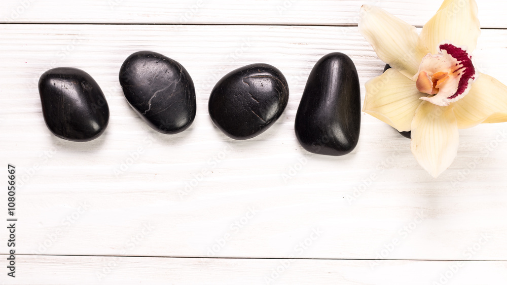 spa concept with stones, flowers , essential oils and mineral salt on wooden table spa concept with stones, flowers , essential oils and mineral salt on wooden table
