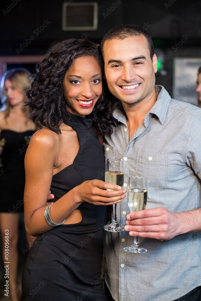 Smiling couple drinking champagne Smiling couple drinking champagne