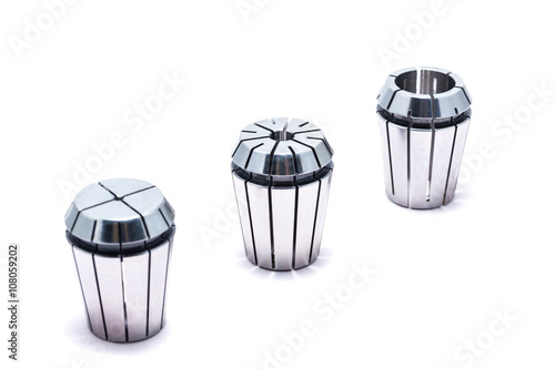 Metal collets for instruments for heavy industry on white background photo