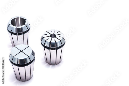 Metal collets for instruments for heavy industry on white background photo