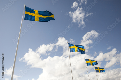 A row of four Swedish flags