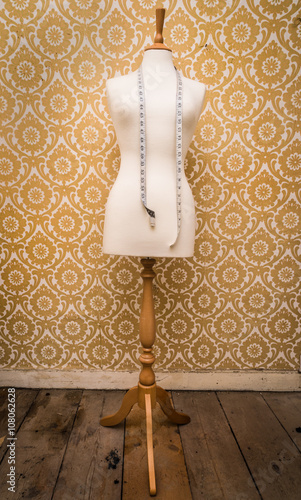 mannequin dress form and tape measure vintage  background