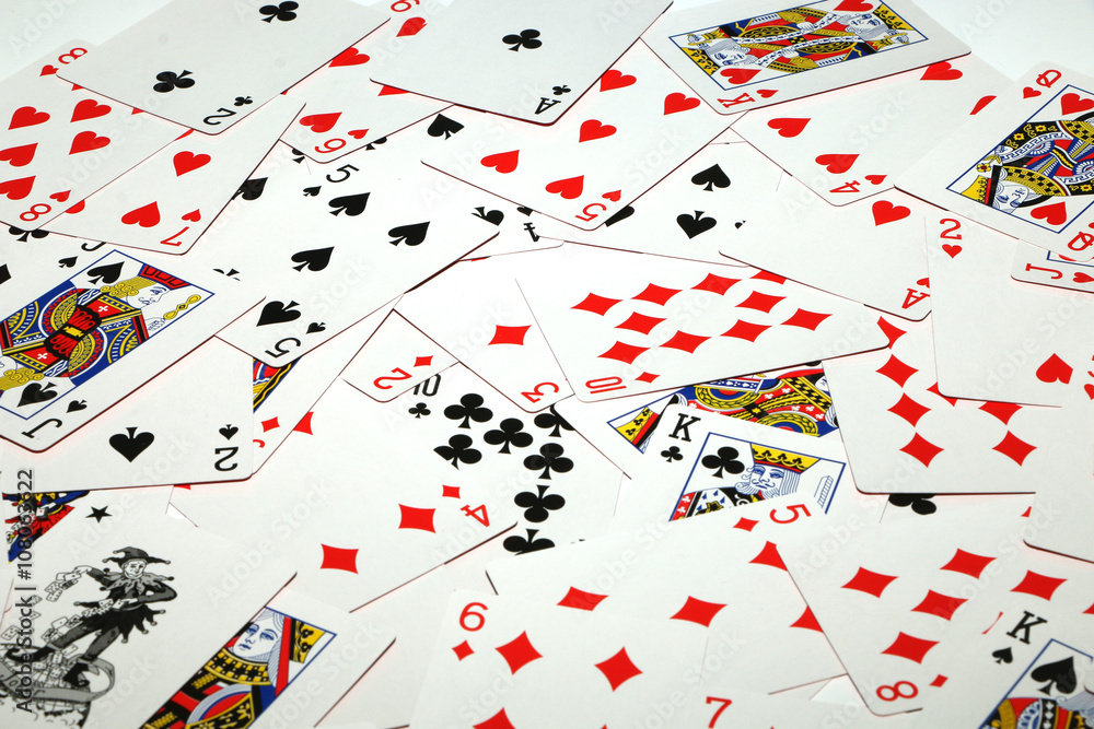 Playing cards laid out on a white background Playing cards laid out on a white background