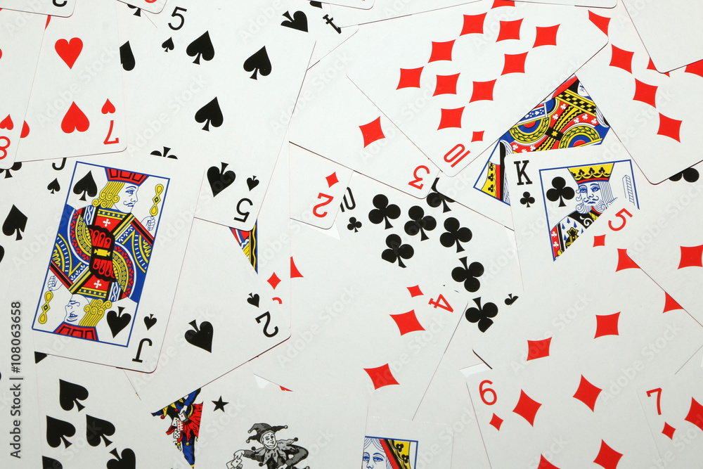 Playing cards laid out on a white background Playing cards laid out on a white background