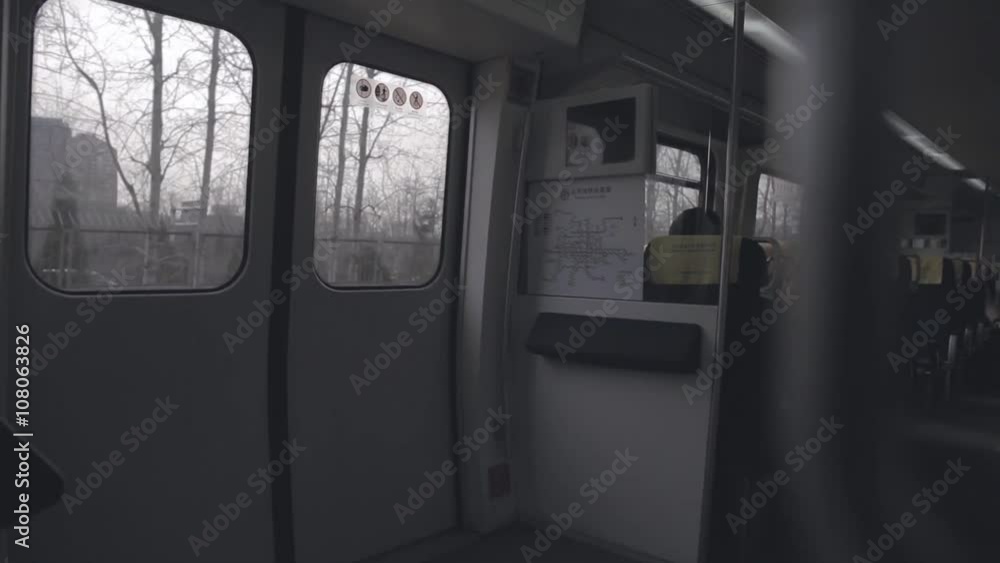 View of doors of the express subway train carriage. Transit or transportation system in Beijing, China.Handheld shot with foreground. View of doors of the express subway train carriage. Transit or transportation system in Beijing, China.Handheld shot with foreground.