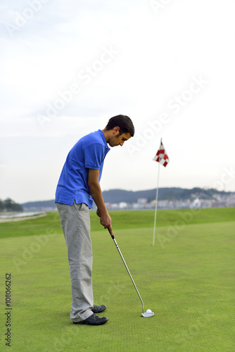 Young man playing golf