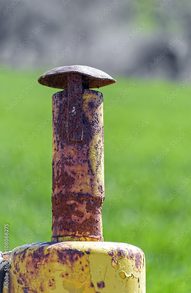 Old and oxidized exhaust pipe, of farming machinery. Natural colors. Old and oxidized exhaust pipe, of farming machinery. Natural colors.