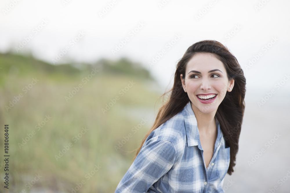 Hispanic woman smiling on beach Hispanic woman smiling on beach
