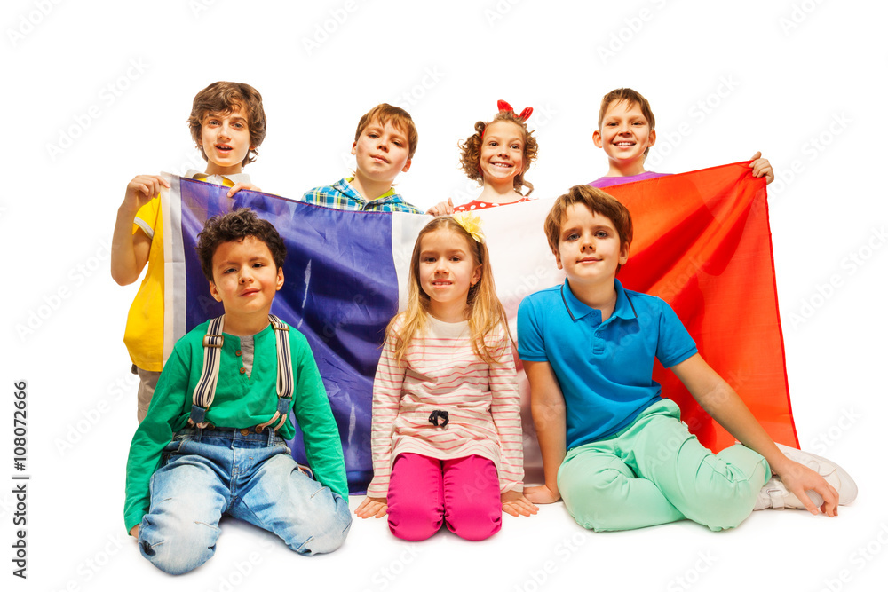 Group of age-diverse kids with French flag Group of age-diverse kids with French flag