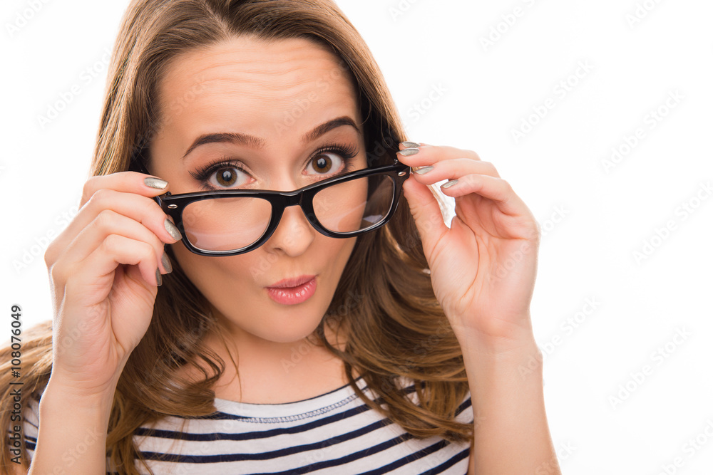 Close up portrait of surprised woman in glasses and striped T-sh Close up portrait of surprised woman in glasses and striped T-sh