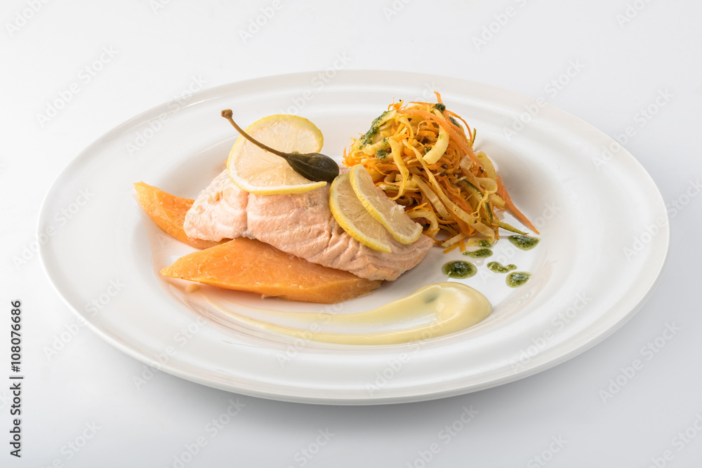 Grilled salmon, mango and salad on a plate Grilled salmon, mango and salad on a plate