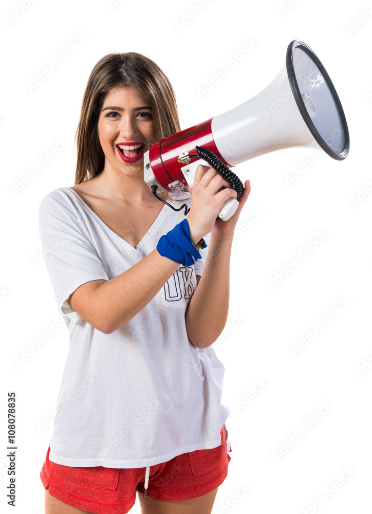 Young girl shouting by megaphone Young girl shouting by megaphone
