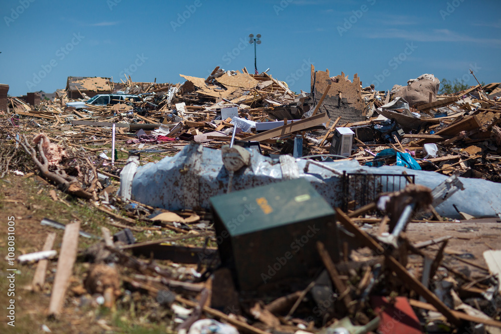 Propane Tanks Lined Up in front of debris from a destructive tornado Propane Tanks Lined Up in front of debris from a destructive tornado